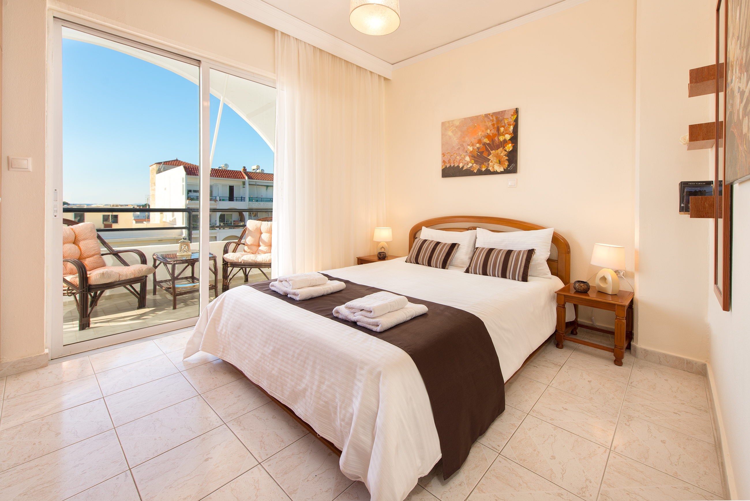 Bedroom with double bed and balcony access